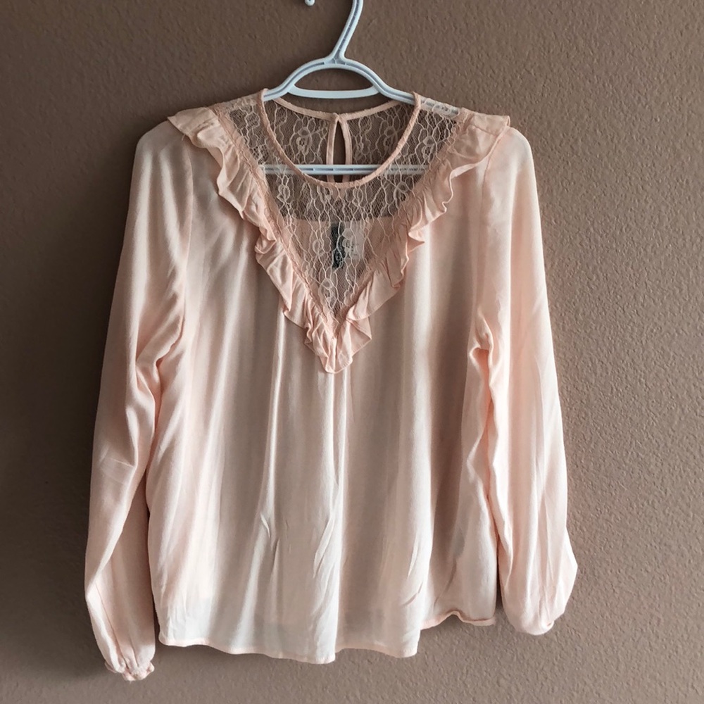 baby pink ruffled blouse